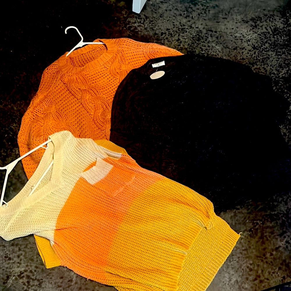 Three medium new/like new sweaters